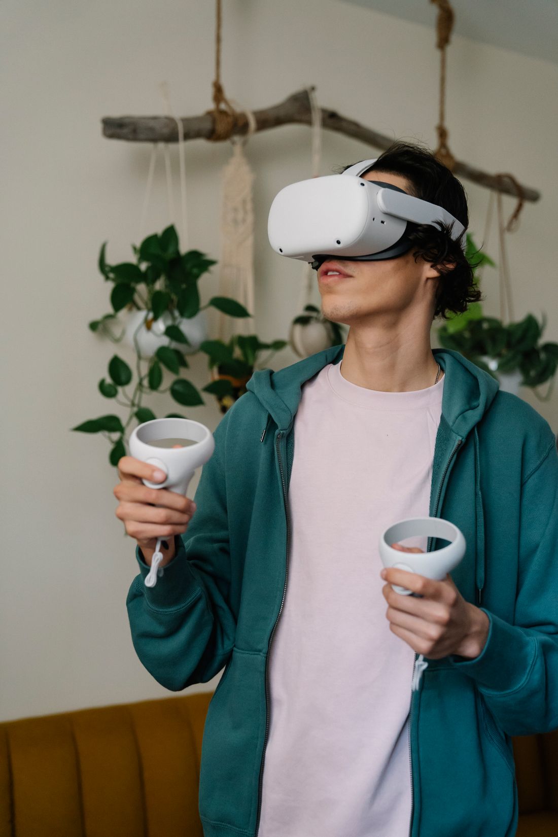 A person using a virtual reality headset in a living room.