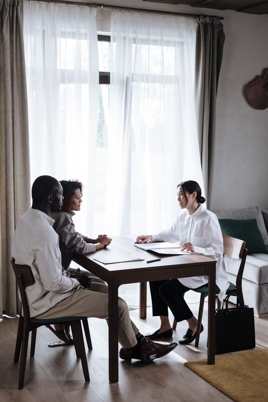 Professionals talking in a bright office.