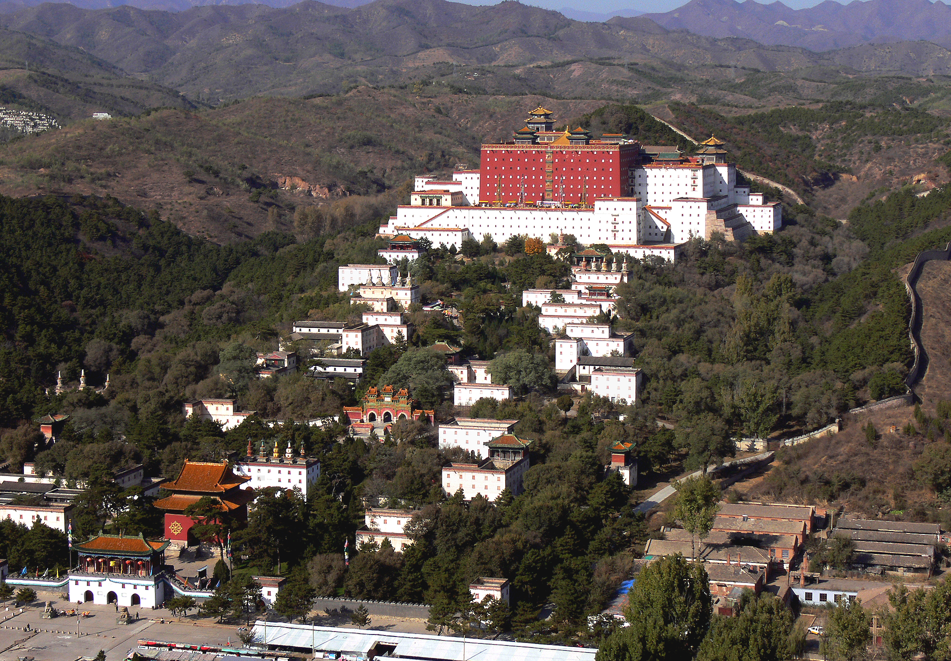 Panoramic view of the red and white buildings of Putuo Zongcheng Temple on a Chengde hillside