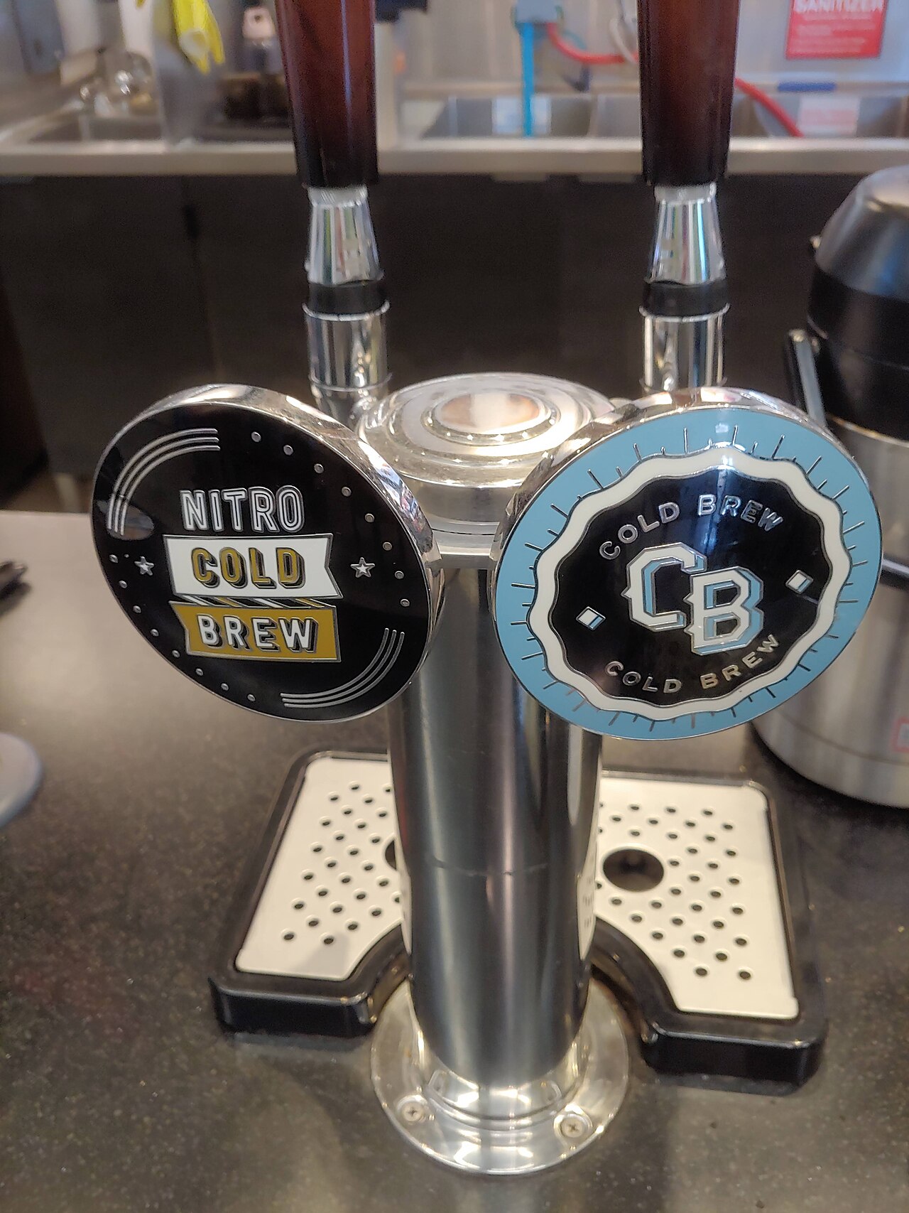 Two coffee taps side by side, labelled Nitro Cold Brew and Cold Brew.