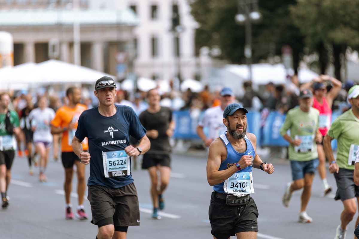 Runners competing in a city road race.
