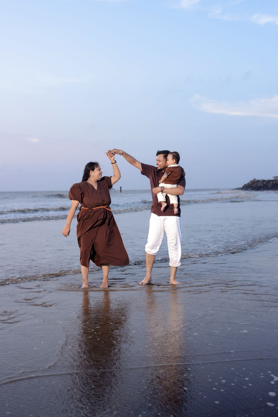 A family enjoying time together at a beach.